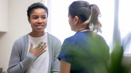 A woman talking to a medical professional